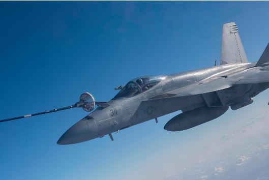 The CC-150T Polaris Air Task Force Iraq crew performs an air to air refueling mission with an USN F-18E fighter jet during Operation IMPACT in February 2018. Photo: Op IMPACT, DND KW08-2018-0136-063 