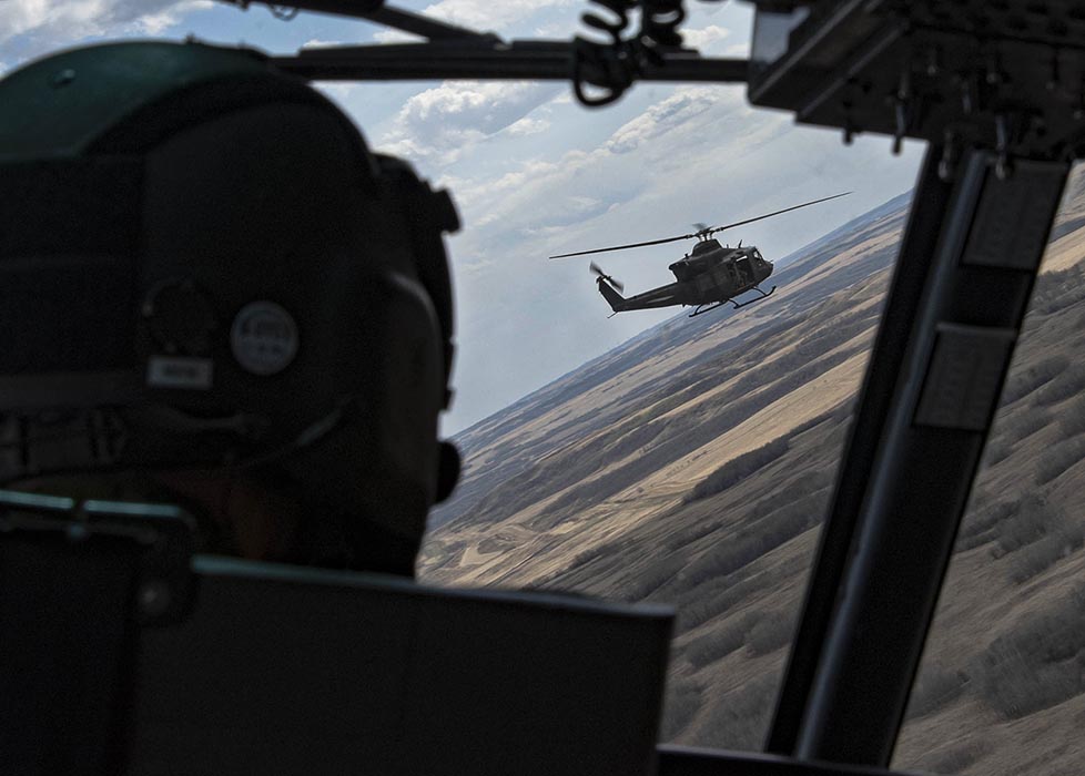 A CH-146 Griffon helicopter from 430 Tactical Helicopter Squadron conducts a reconnaissance flight during Exercise MAPLE RESOLVE 21.