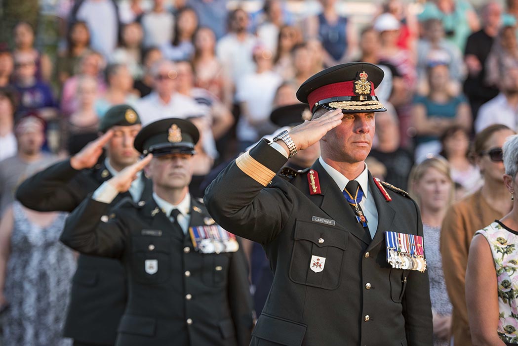 Lieutenant-General Jean-Marc Lanthier, Commander of the Canadian Army, salutes while the national anthem plays during the annual Fortissimo event on Parliament Hill in Ottawa, Ontario on July 19, 2018. Photo: Ordinary Seaman Camden Scott, Army Public Affairs. ©2018 DND/MDN Canada.