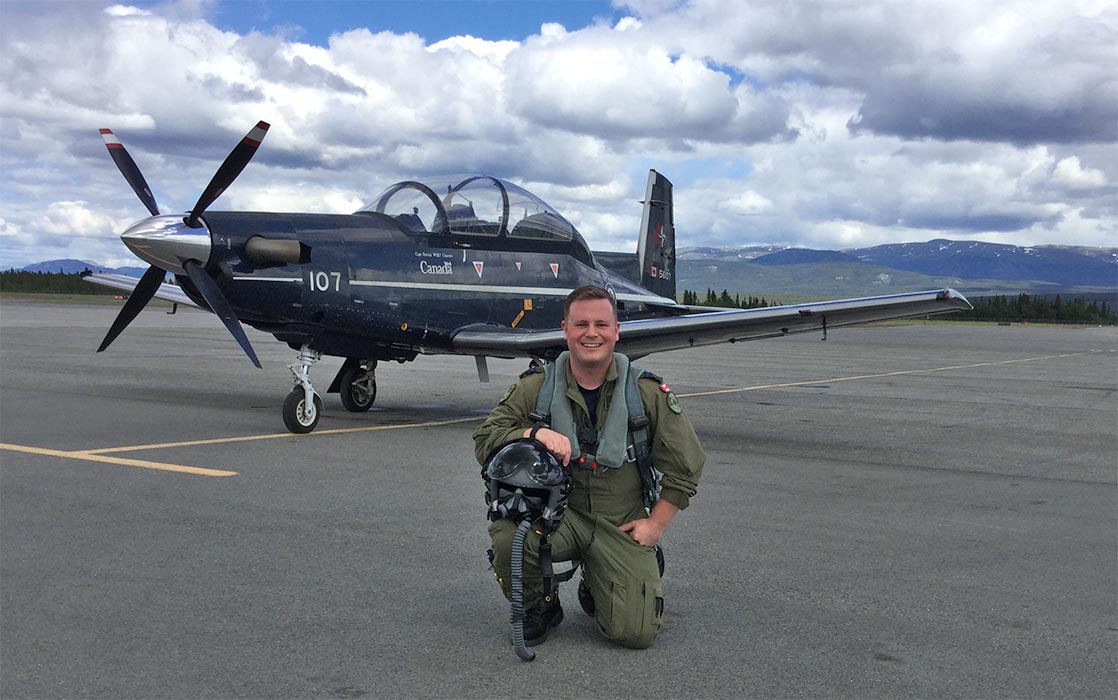 Captain Erik Temple pictured after landing at Erik Nielsen Whitehorse International Airport (which is named after his grandfather) in a CT-156 Harvard II. Capt Temple is a former Army musician and current Air Force flight instructor who recently reunited with his former unit to perform a flypast during the 2019 Fortissimo event in Ottawa. 
Photo: provided by Captain Erik Temple.
