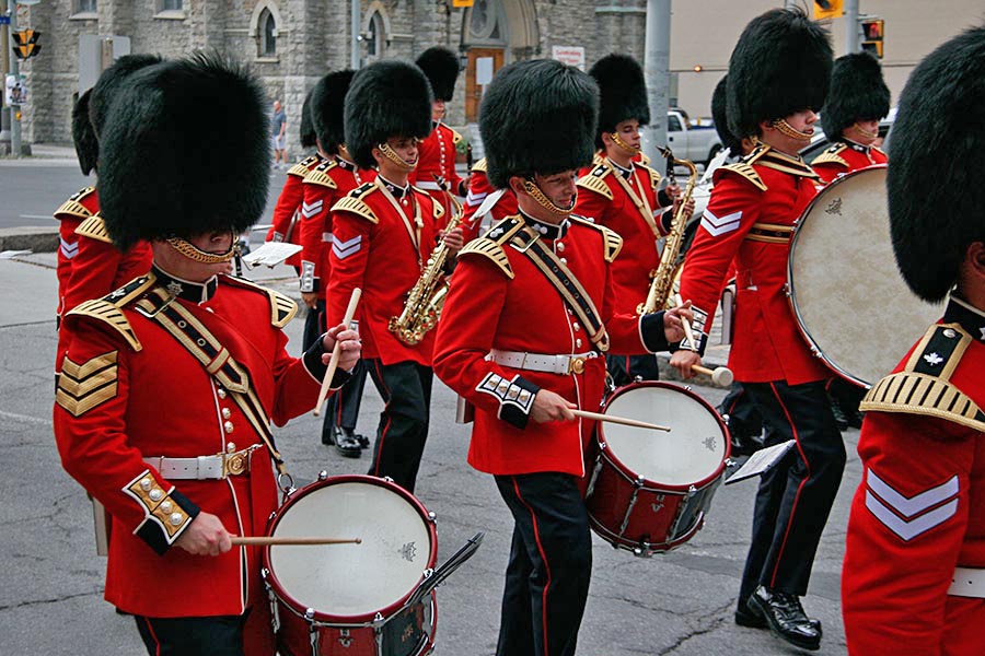 Captain Erik Temple (centre) plays the snare drum with the Ceremonial Guard (CG) during the daily Changing of the Guard ceremony in Ottawa. Capt Temple is now an Air Force flight instructor and says many of the lessons he learned with the CG still apply. 
Photo: provided by Captain Erik Temple.
