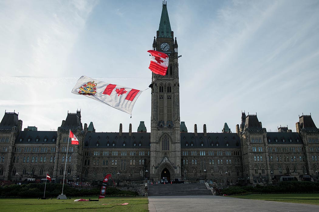 The Canadian Armed Forces Parachute Team, The SkyHawks, perform aerobatic parachute formations during Fortissimo 2019 on Parliament Hill in Ottawa, Ontario, July 18, 2019. Photo: Ordinary Seaman Alexandra Proulx, Army Public Affairs. ©2019 DND/MDN Canada.