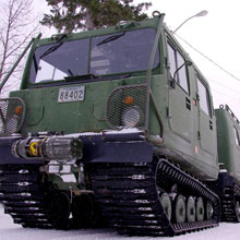 The cars of the BV 206 Tracked Carrier are coupled together by a central steering assembly.