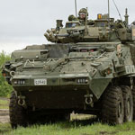 Canadian Light Armoured Vehicles move in a convoy in the Wainwright Garrison training area during Exercise MAPLE RESOLVE on May 23, 2016. Photo: Sgt Jean-Francois Lauzé, Garrison Imaging Petawawa 