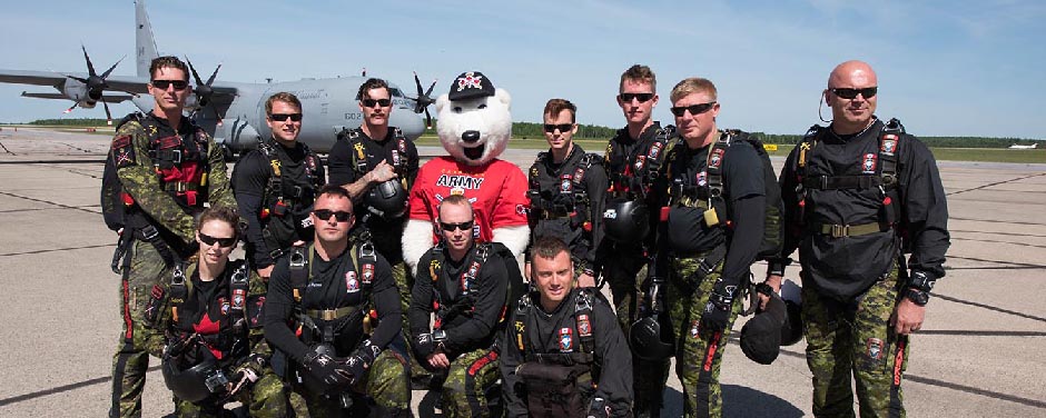 Slide - Juno the Canadian Army Mascot and the SkyHawks.