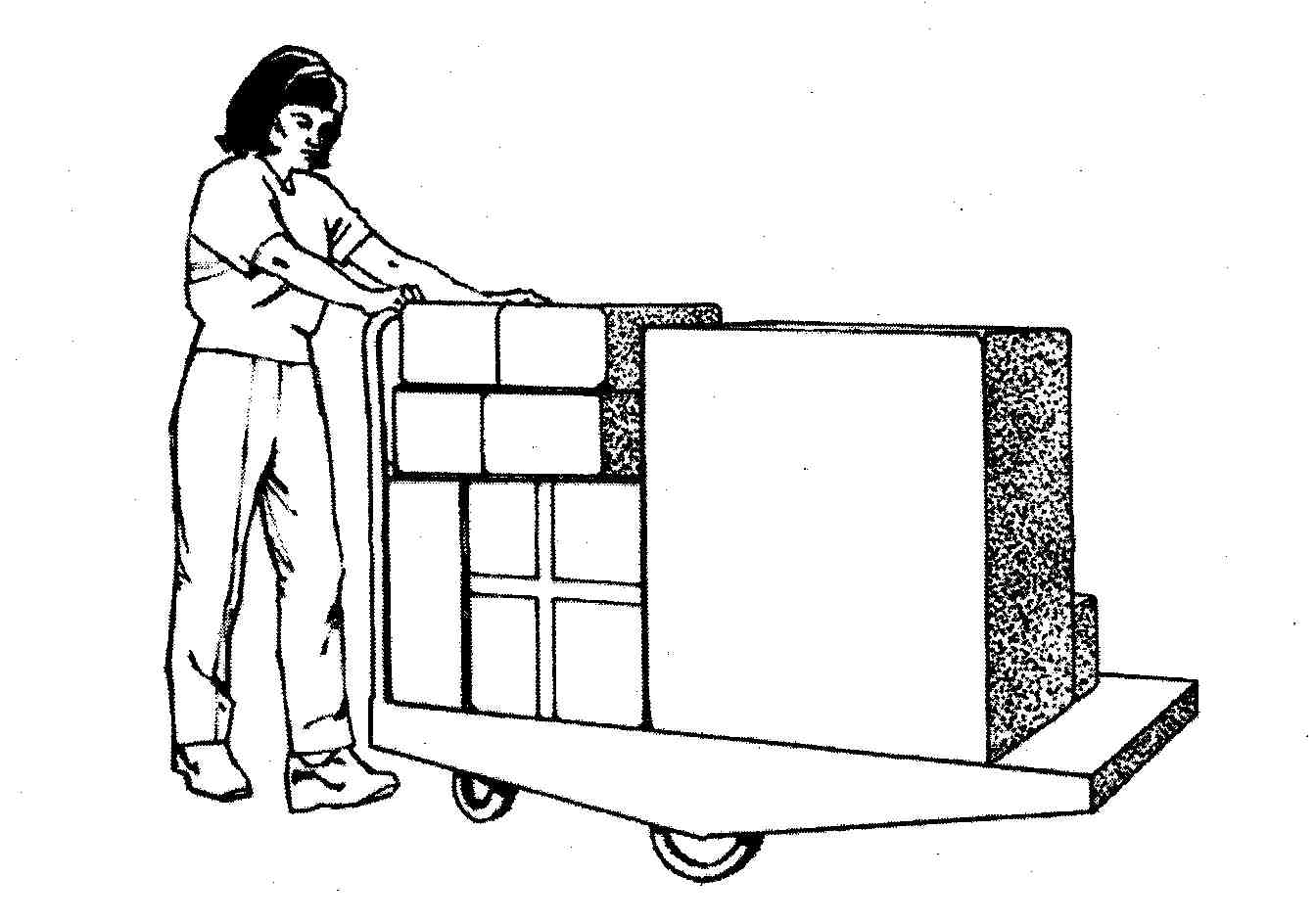 Une personne qui pousse un chariot remplie de boîtes.