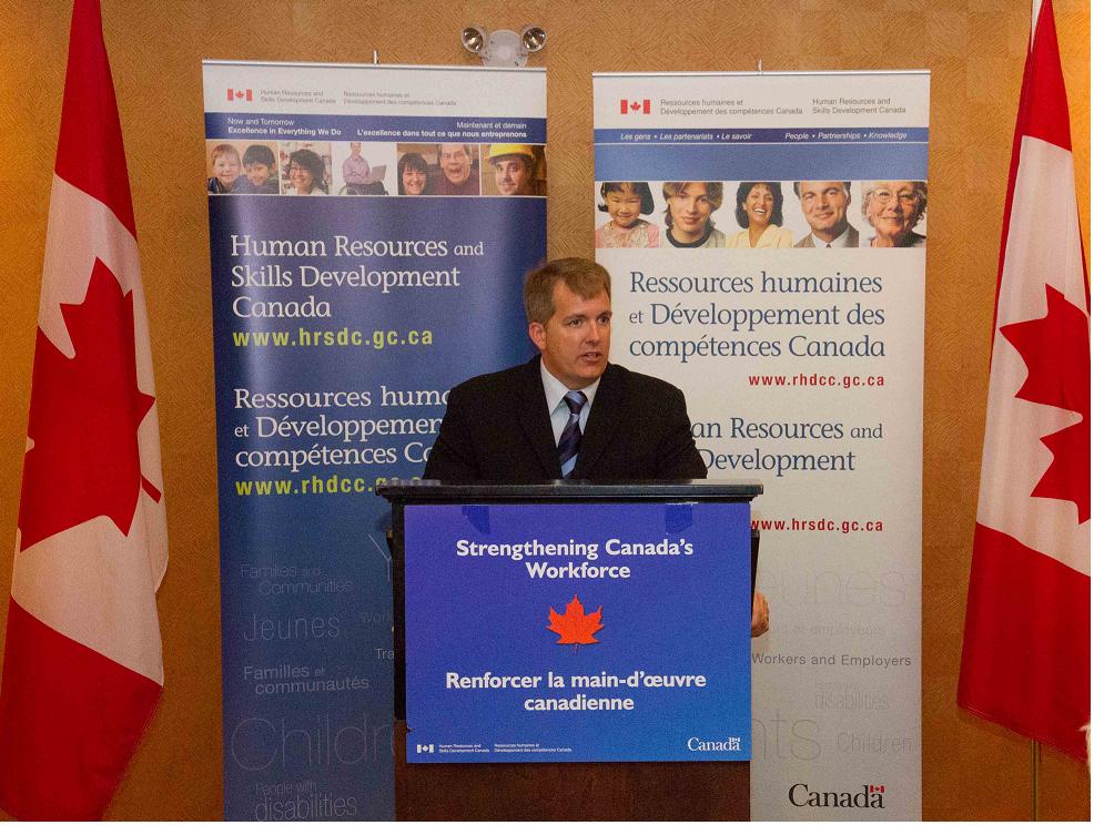MP Armstrong at the podium.