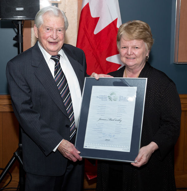Long-time North Shore resident James MacCarthy receives the National Recreational Fisheries Award from the Honourable Gail Shea, Minister of Fisheries and Oceans.