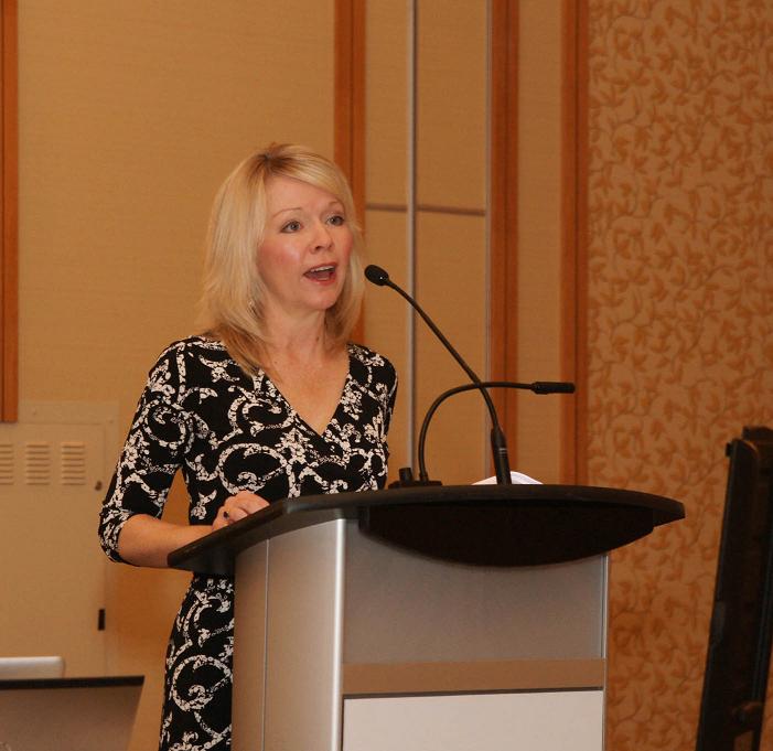 Minister Bergen at the podium.