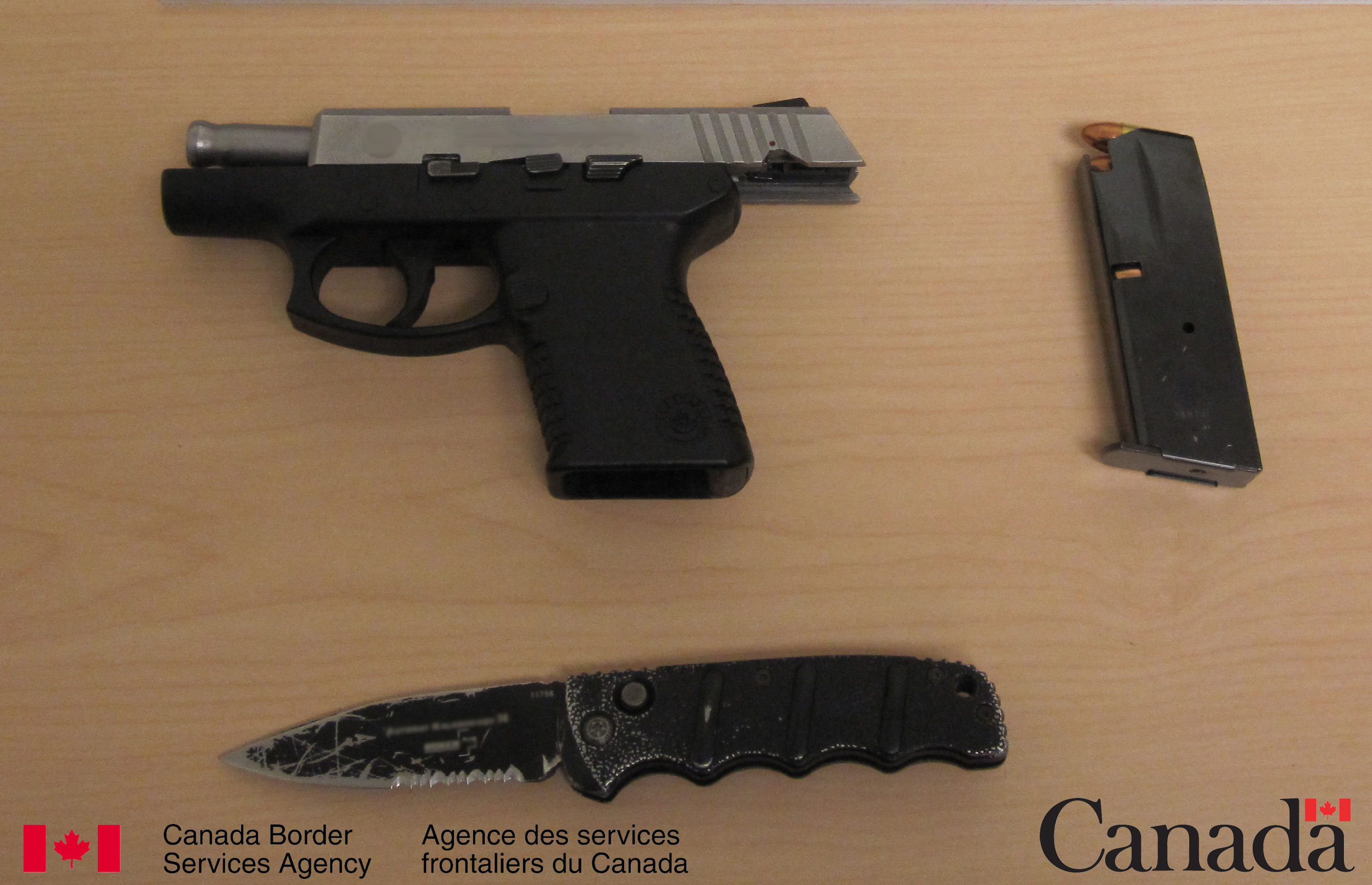 Firearm and switchblade knife seized at Coutts on March 21, 2014. 