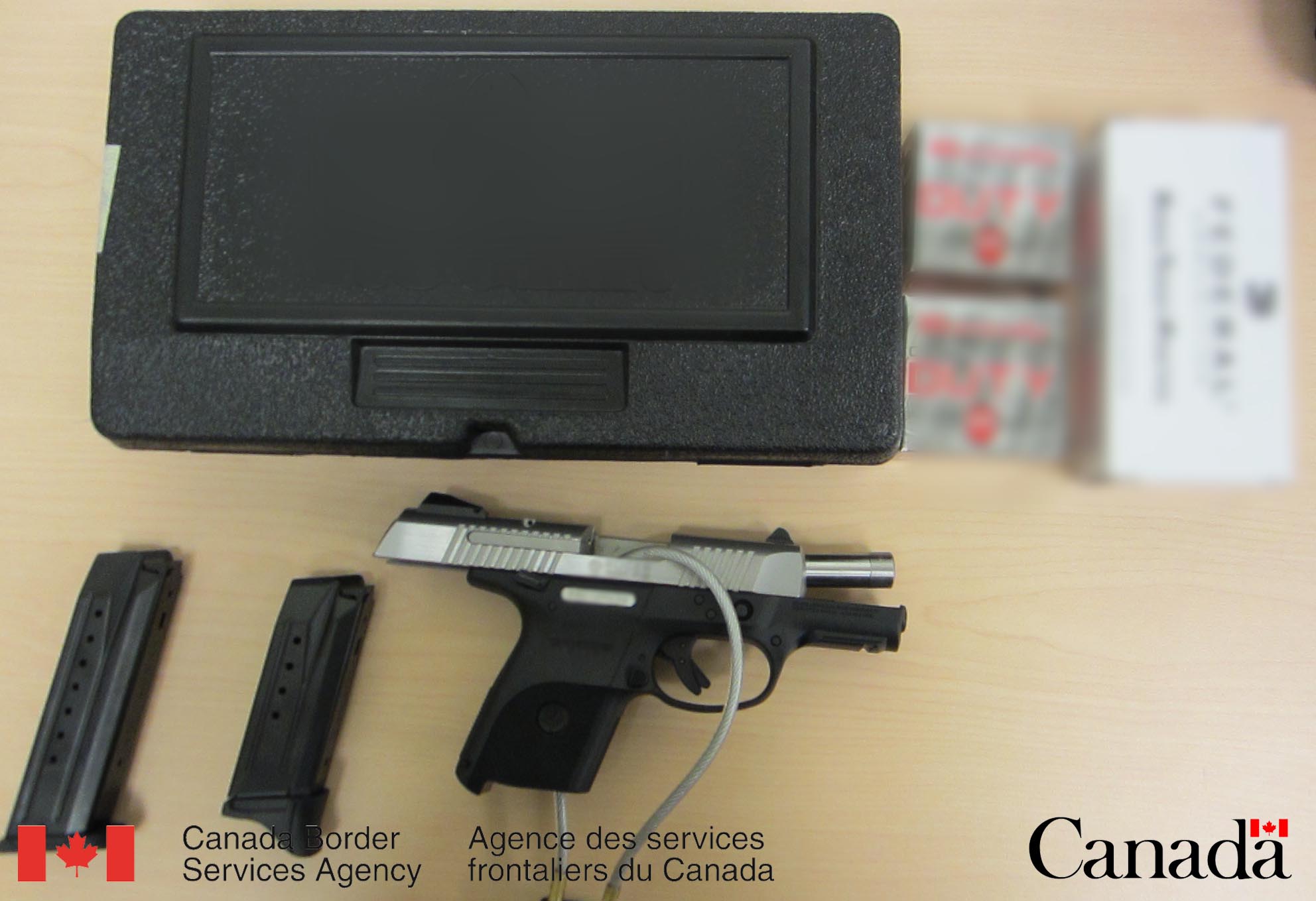 Firearm and magazines seized at Coutts on September 13, 2013.