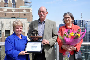 Minister Gail Shea presents the 2013 Small Craft Harbours Prix d'Excellence to Mr. Michael Griswold today in Vancouver, British Columbia. Penny Dowler (right) was thanked for her ongoing support to her husband.
