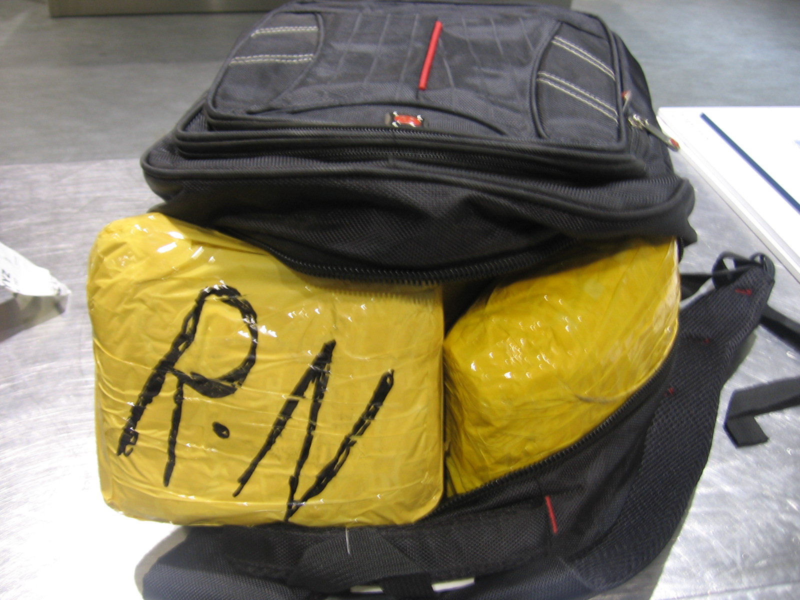Packages inside a backpack with the suspected heroin.