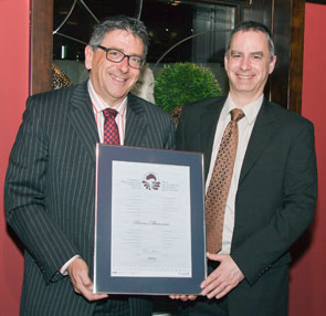 Pierre Manseau, left, receives one of the five Canada National Recreational Fisheries Awards from Patrick Vincent, Regional Director, Fisheries Management, Fisheries and Oceans Canada.