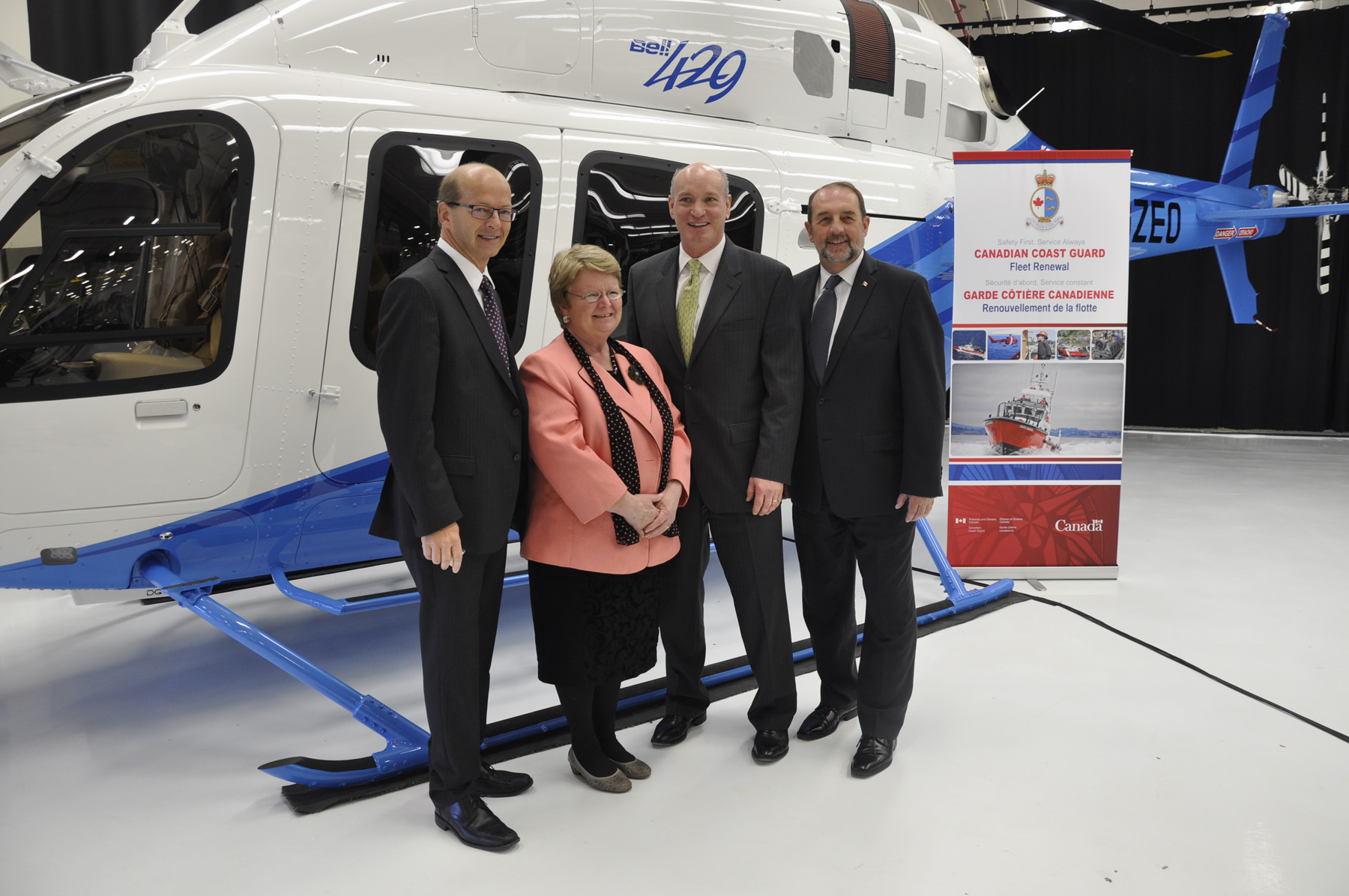 Minister Gail Shea and Minister Denis Lebel award contract for 15 new Coast Guard helicopters to Bell Helicopter on May 12, 2014.  (L-R) Senator Claude Carignan; Minister Shea; Bell Helicopter President Barry Kohler; and Minister Lebel.