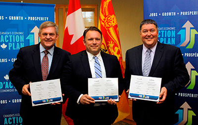 From left to right: The Honourable David Alward, Premier of New Brunswick; the Honourable Rob Moore, Regional Minister for New Brunswick and Minister of State (Atlantic Canada Opportunities Agency); and the Honourable Danny Soucy, New Brunswick Minister of Environment and Local Government, celebrate the renewed federal Gas Tax Fund in New Brunswick. 