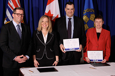 Bob Zimmer, Member of Parliament for Prince George-Peace River; the Honourable Coralee Oakes, Minister of Community, Sport and Cultural Development; the Honourable James Moore, Minister of Industry and Minister Responsible for British Columbia; and Rhona Martin, President of the Union of British Columbia Municipalities, participated in the signing ceremony of British Columbia's renewed federal Gas Tax Fund Agreement.