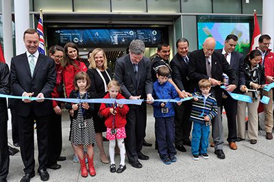 Vancouver Aquarium officials and supporters officially cut the ribbon in front of the Aquarium¿s new entrance on June 13, 2014 to unveil the most significant expansion in the organization¿s 58-year history.  From L-R: Mr. Don Lindsay, President and CEO of Teck; Minister Coralee Oakes, Minister of Community, Sport and Cultural Development and MLA for Cariboo North; Mr. Brian Hanna, Chair of the Vancouver Aquarium¿s Board of Directors; Mr. John Nightingale, Vancouver Aquarium¿s President and CEO; and Minister James Moore, Minister of Industry and Member of Parliament for Port Moody-Westwood-Port Coquitlam, along with school children, First Nations representations, staff and volunteers.