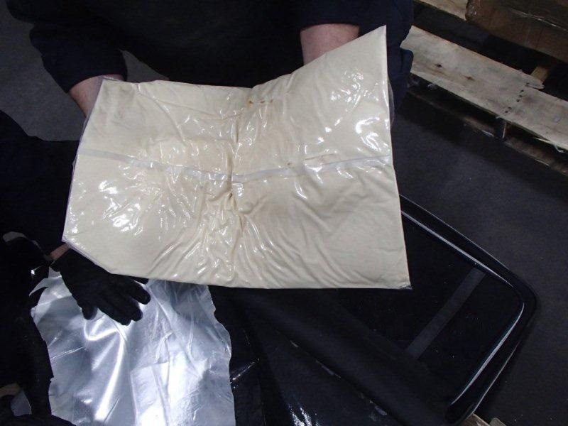 
Cocaine concealed within the back wall of suitcases.