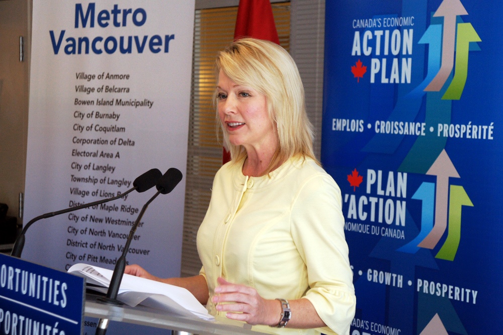 Minister Bergen at the podium.