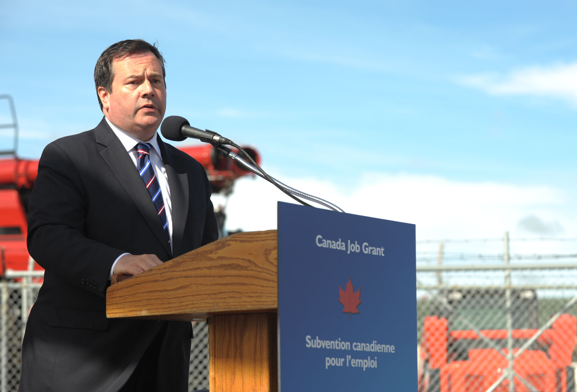 Minister Kenney at the podium.