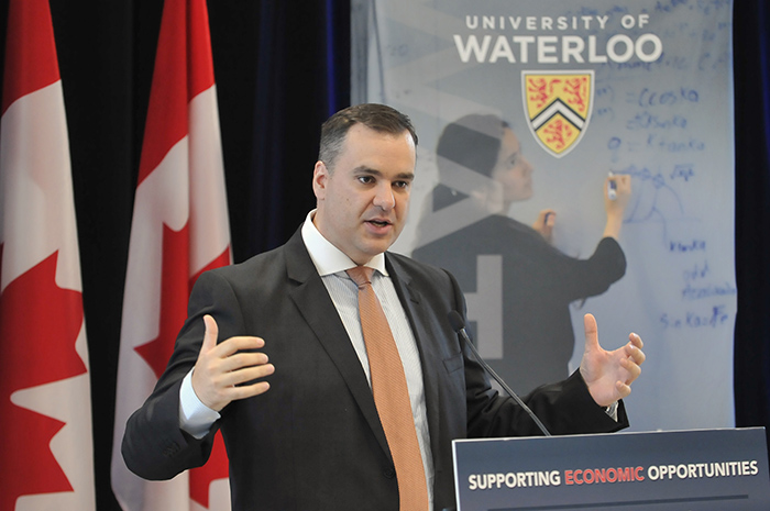 Industry Minister James Moore announces new electronic labelling regulations for telecommunication devices during his visit to the University of Waterloo's Faculty of Engineering on October 3, 2014.