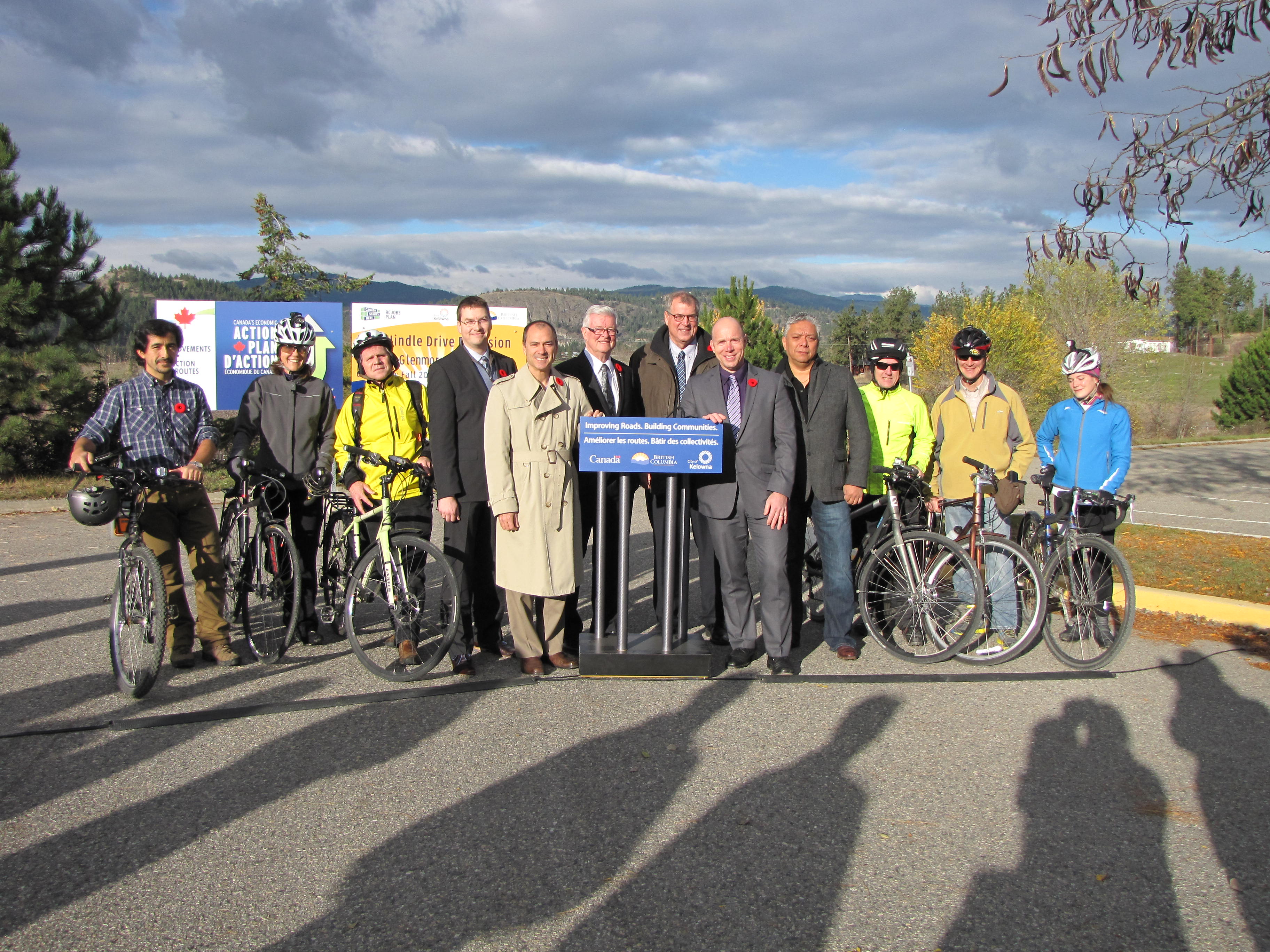 Left to right: Kelowna cyclists join Fabian Cidyanez, UBCO student; Michael Shakespeare, UBCO Associate VP, Finance & Operations; the Honourable Norm Letnick; Walter Gray, Mayor of Kelowna; the Honourable Steve Thomson, MLA Kelowna-Mission Honourable; the Honourable Ron Cannan, and Chief Byron Louis of the Okanagan Indian Band.