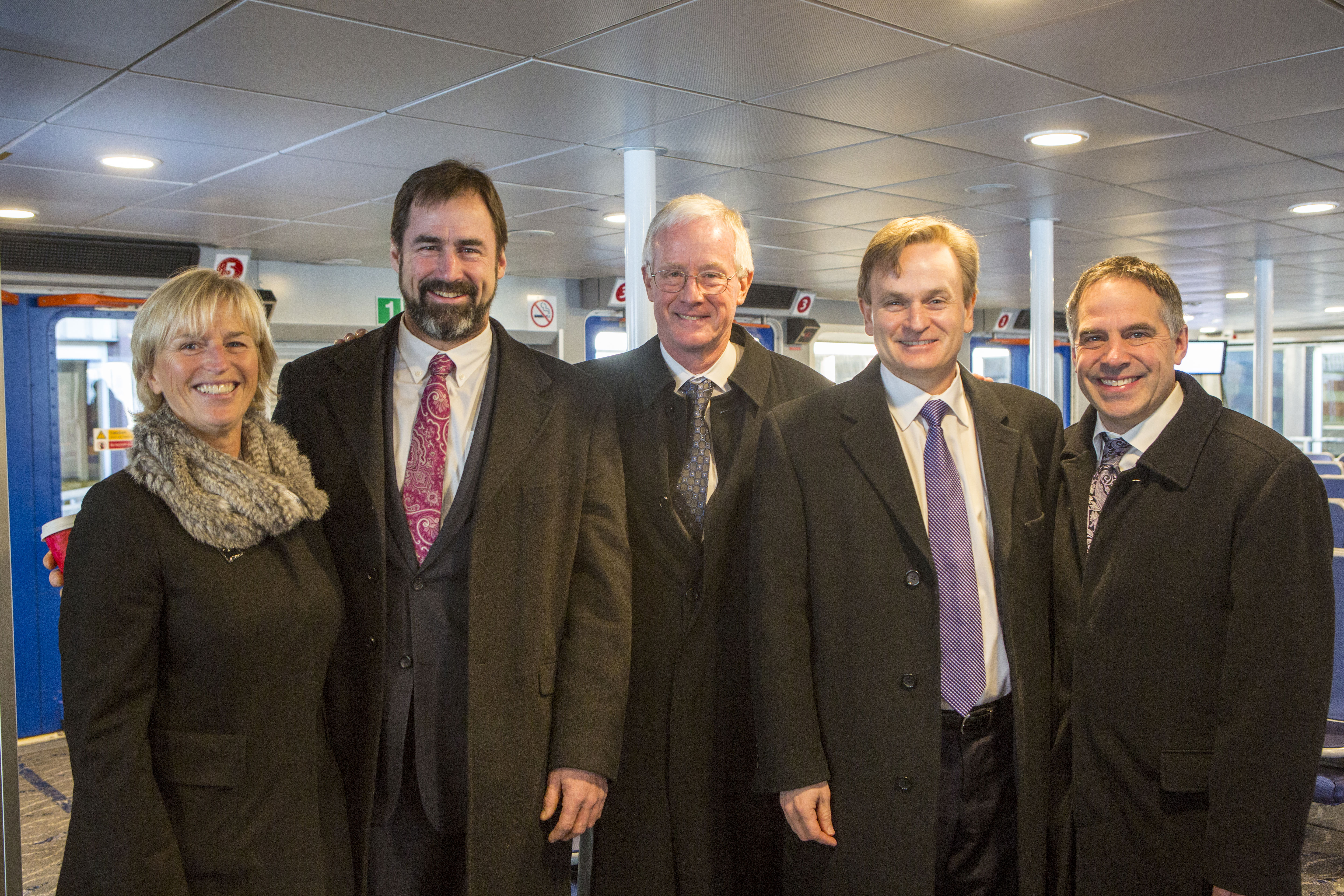 From left to right: Marcella Szel, TransLink Board Chair, Jordan Sturdy, British Columbia's Parliamentary Secretary to the Minister of Transportation and Infrastructure, Richard Walton, Mayor of the District of North Vancouver, Andrew Saxton, Parliamentary Secretary to the Minister of Finance and Member of Parliament for North Vancouver, and Darrell Mussatto, Mayor of the City of North Vancouver, gathered to mark the maiden voyage of TransLink's newest addition to the SeaBus fleet, the Burrard Otter II.