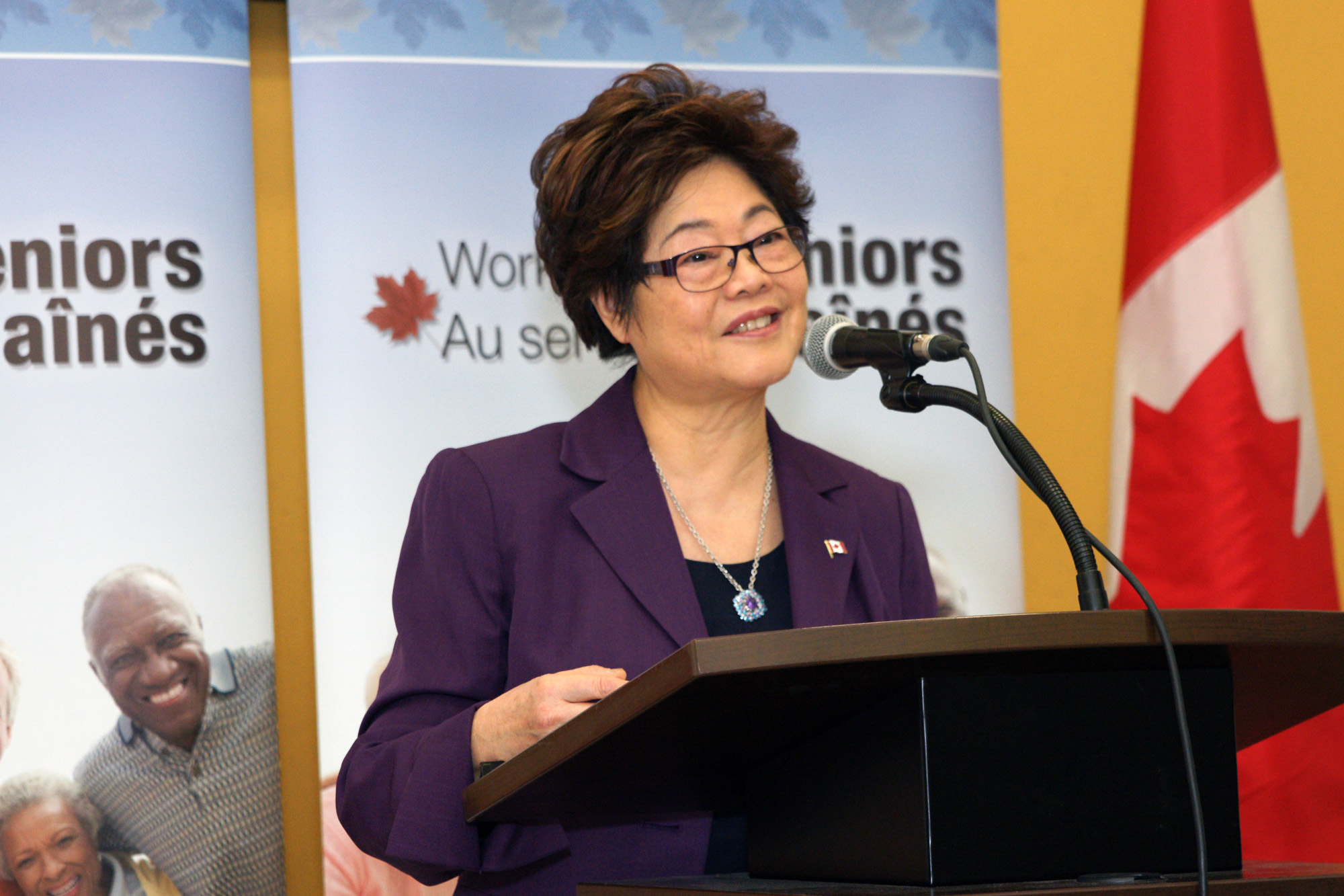 Minister of State Wong at the podium.