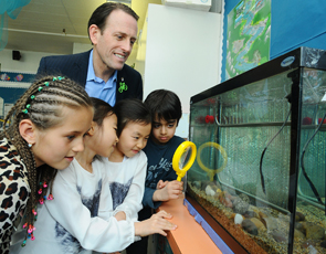 Students at Irwin Park Elementary School show MP John Weston (West Vancouver-Sunshine Coast-Sea to Sky Country) the tank in their classroom containing salmon that are growing from eggs to fry. The students are involved in the Government of Canada¿s Stream to Sea education program.