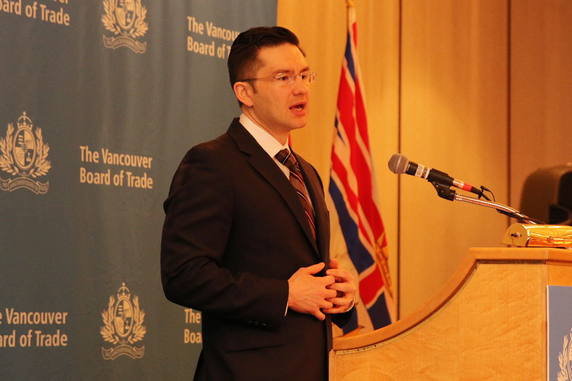Minister Poilievre at the podium 