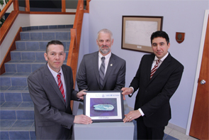Michel Goguen, Regional Director of the Canadian Hydrographic Service for Fisheries and Oceans Canada, alongside CARIS representatives, showcases one of the 3D models of HMS Erebus developed from data collected by the Canadian Hydrographic Service. 
