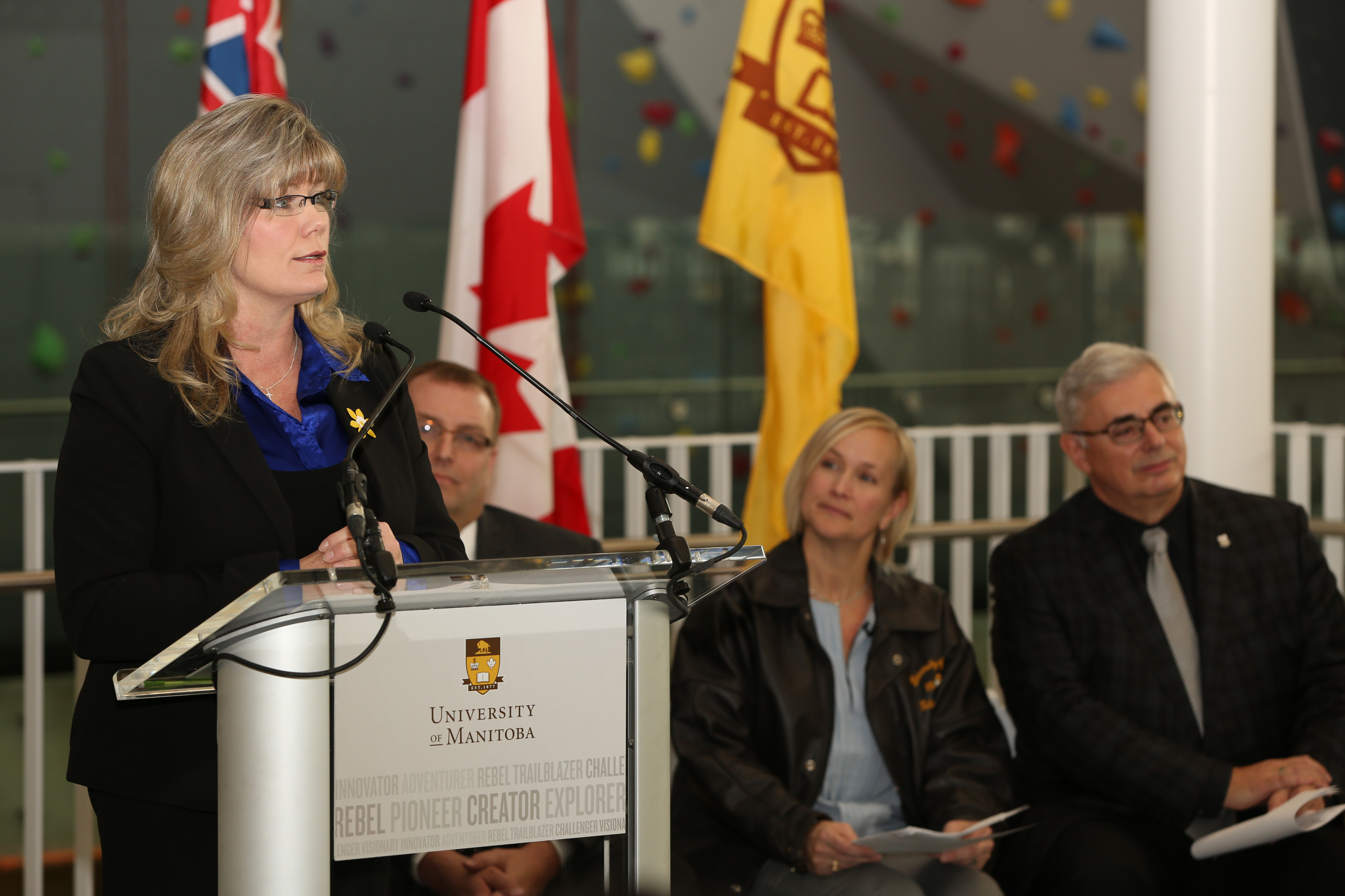 From left to right: Shelly Glover, Minister of Canadian Heritage and Official Languages, Peter Bjornson, Minister of Education and Advanced Learning, Michelle Sawatzky, University of Manitoba and Bison alumna, '96 Olympian (Women's Volleyball), David T. Barnard, President and Vice-Chancellor, University of Manitoba