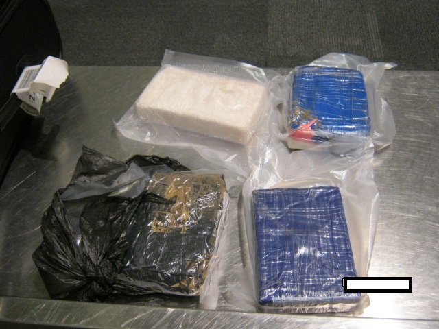 Vacuum packed bricks of suspected cocaine