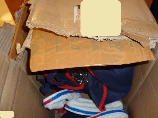 Photo caption: Suspected opium found concealed within cardboard plies.