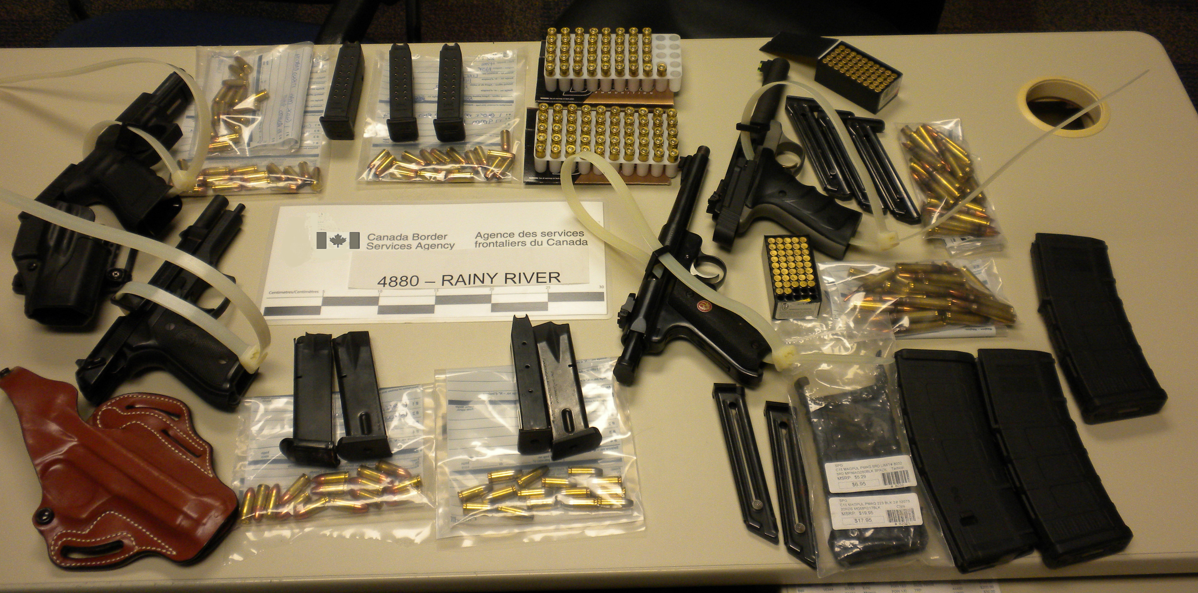 Firearms and ammunition seized by CBSA officers at the Rainy River port of entry on May 21, 2015