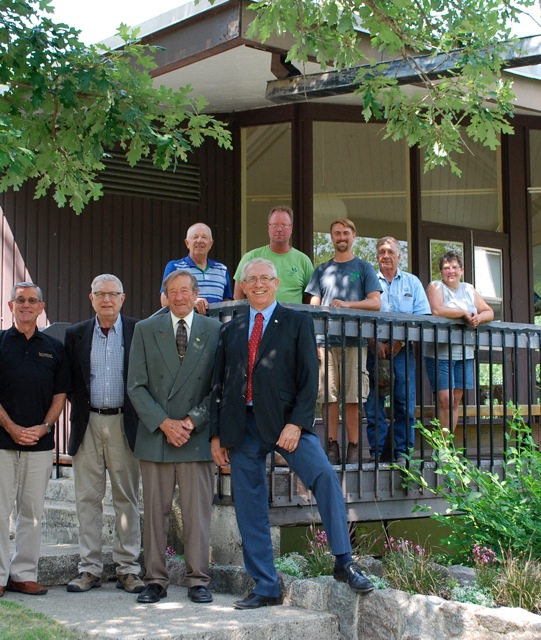 Federal and provincial funding was announced on July 10, 2015 for three projects at the International Peace Garden in southwest Manitoba. Some of those in attendance include (front row - left to right) Rick Felstead, IPG Board member; Charlie Thomsen; IPG Board President; Ed Anderson; IPG Board Member/ Mayor of Boissevain; and Larry Maguire, Member of Parliament from Brandon ¿ Souris. (Back row - left to right): Ed Albrecht, IPG Board Member and some of the IPG Staff - Keith Burton, Johannes Olwage, Rodney Langerquist, Connie Langerquist.