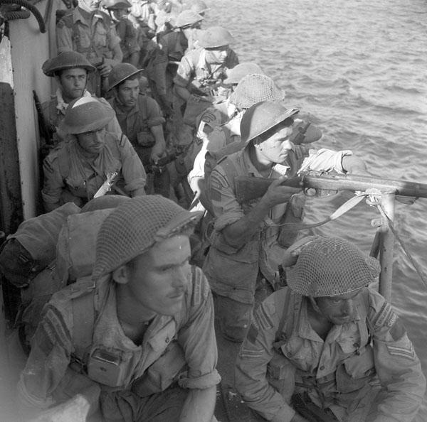 Image Titled:  Personnel of Le Royal 22e Régiment getting ready for disembarkation in Villapiana, Italy in 1943.
Copyright:  Collections Canada, Library and Archives Canada, MIKAN 3396545
From: http://data2.archives.ca/ap/a/a115197-v6.jpg
