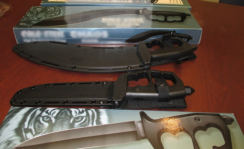 Dagger with enclosed brass knuckles.