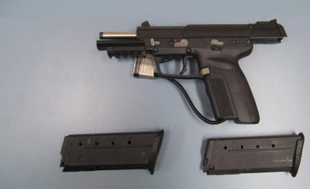 Semi-automatic handgun and overcapacity magazines seized at Boissevain border crossing on January 1.


