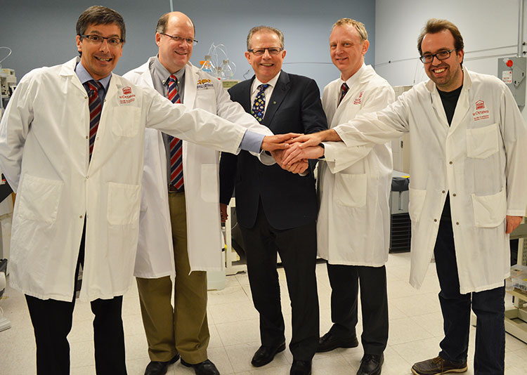 Left-to-right: Dr. Daniel Figeys, University of Ottawa; Dr. David Mack, CHEO Research Institute; Dr. Phillip Sherman, CIHR; Dr. Alain Stintzi, University of Ottawa; Dr. James Butcher, University of Ottawa 
