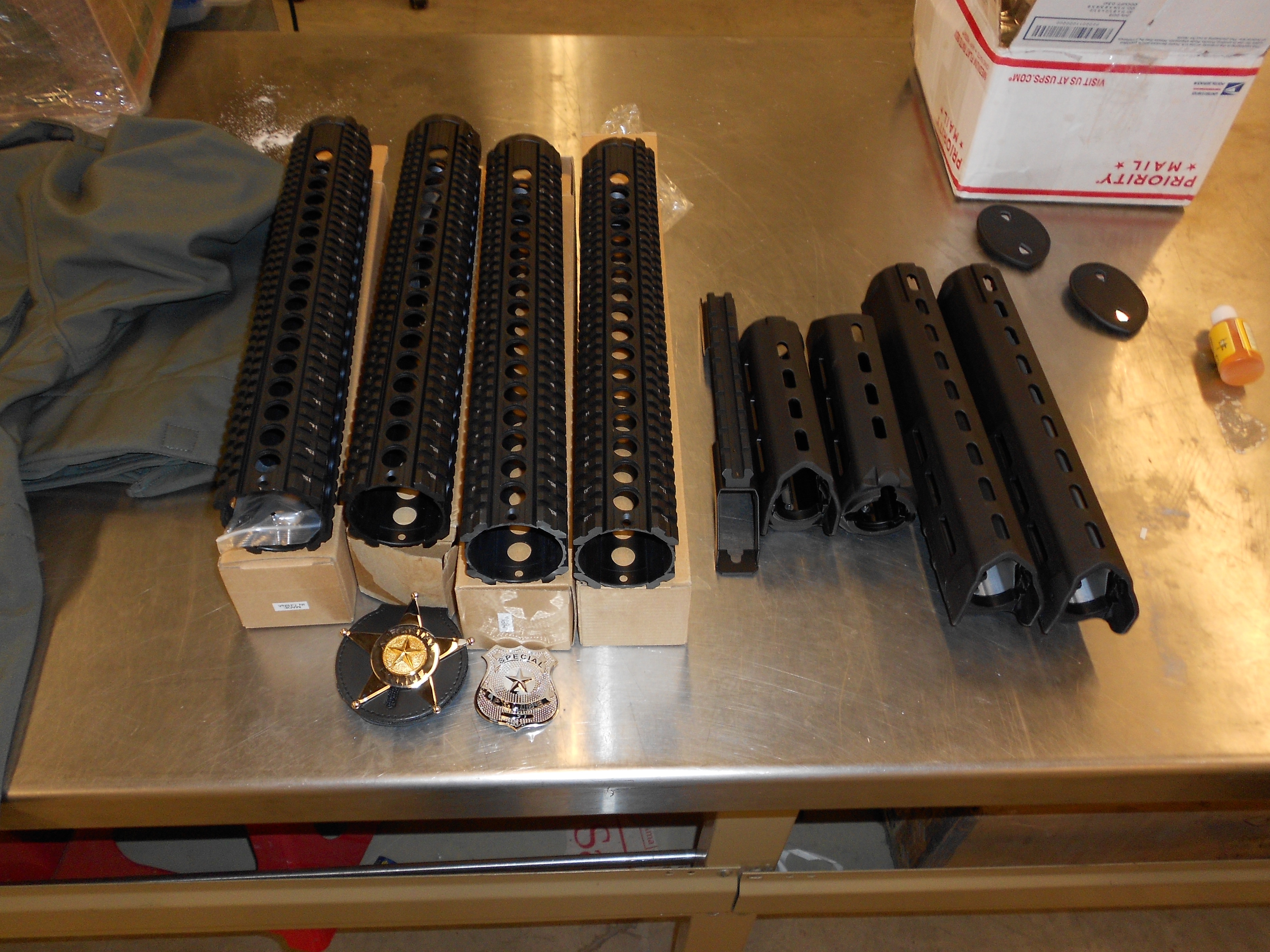 Firearm parts and badges.