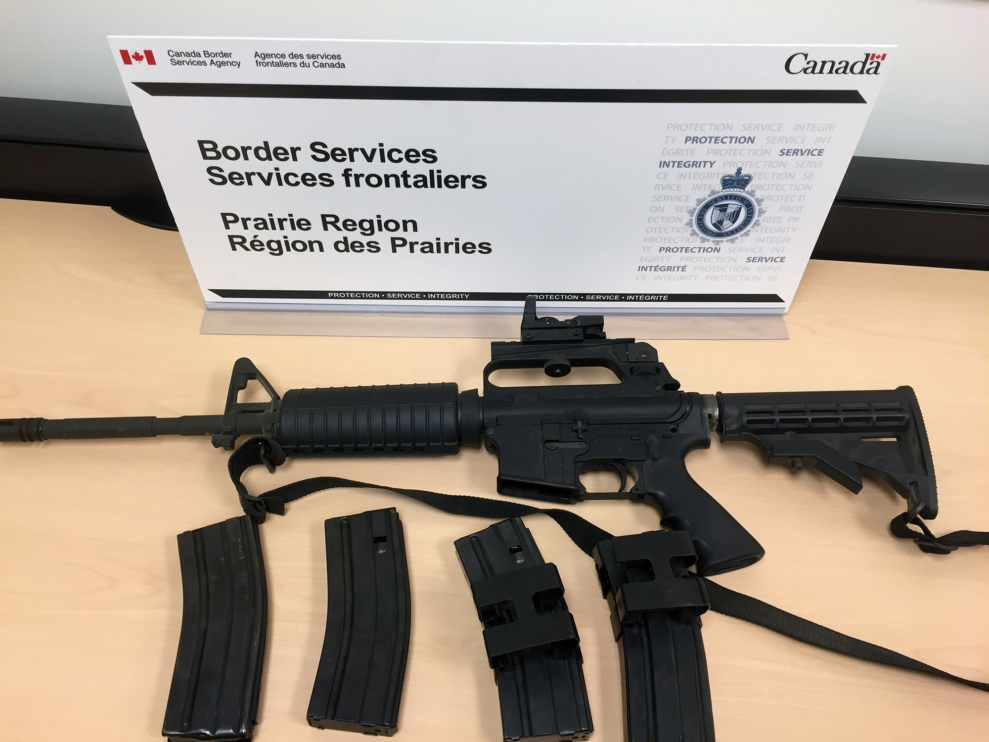 The restricted AR-15 assault rifle and four overcapacity magazines seized at Coutts on June 28. 
