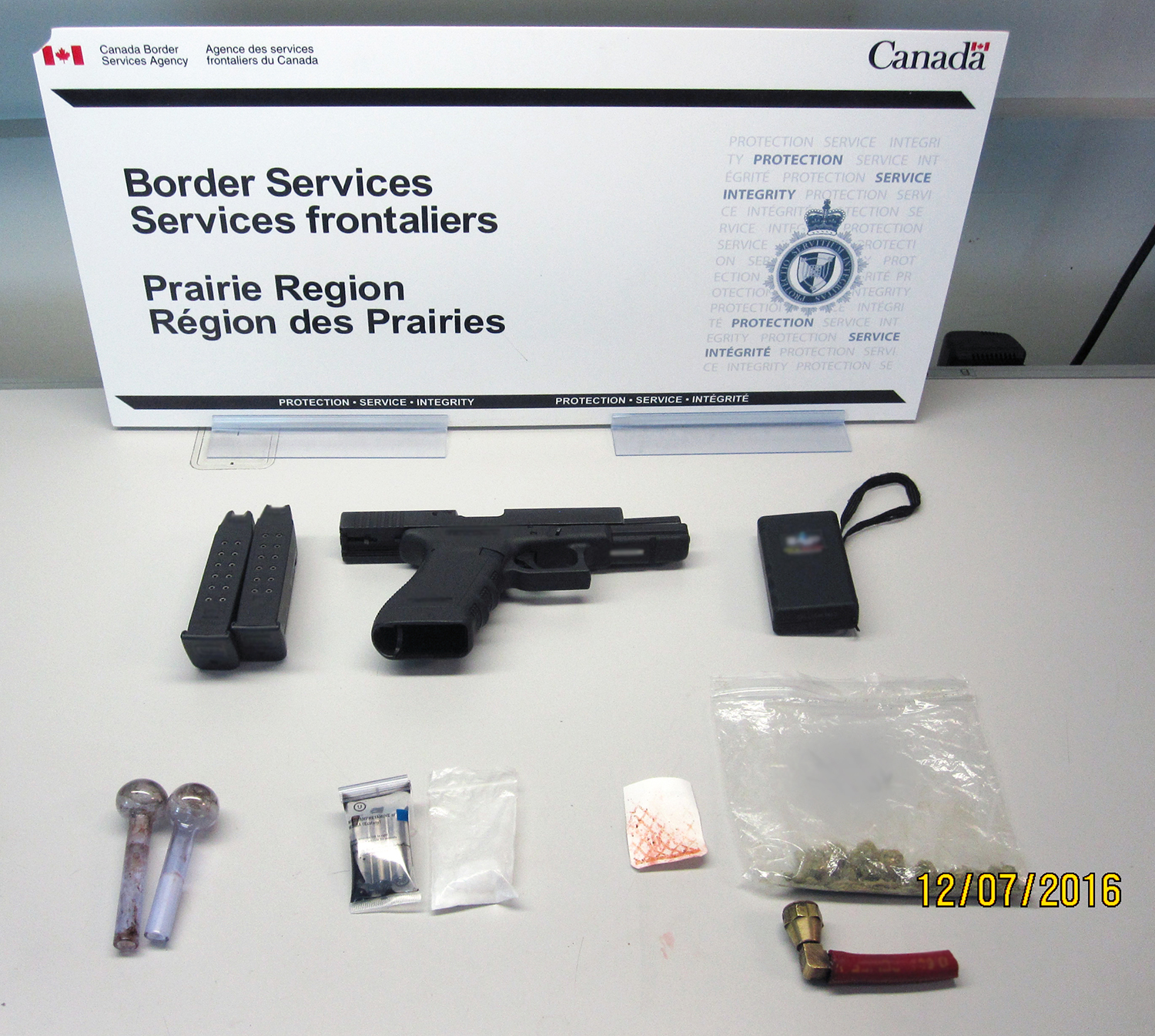 Photo 1

The 9mm handgun seized at Coutts on July 1. 
