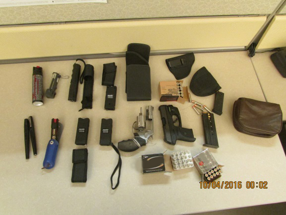 Four tasers, five canisters of pepper spray, a loaded 9mm handgun and a loaded .357 Magnum seized at St. Stephen 3rd Bridge on October 3, 2016.