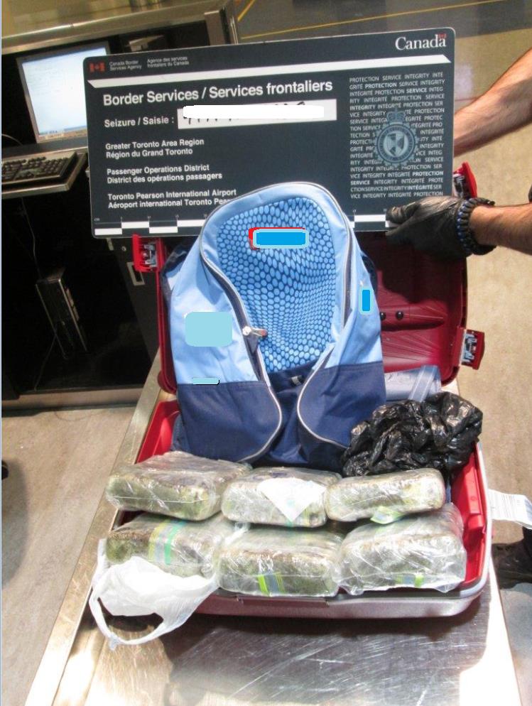 Suspected cocaine found in suitcase.
