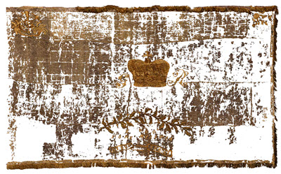 A digitally produced image of the flag shows golden fragments; a white background is visible through areas of loss.