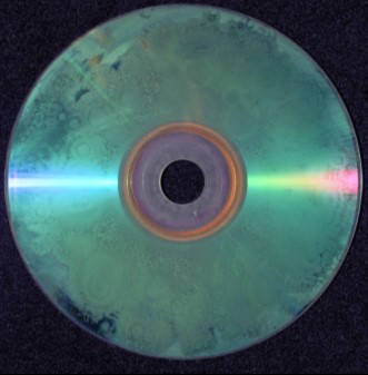 Base side view of a recordable CD showing marring of the surface of the plastic base.