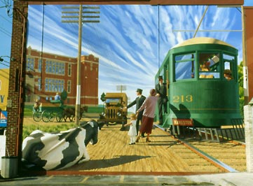 Mural of people at a train station.