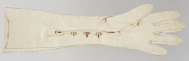 Long off-white glove with small buttons.